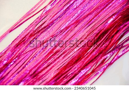 merry christmas. happy new year. xmas decoration. winter holiday party tinsel decor. pink festive background.