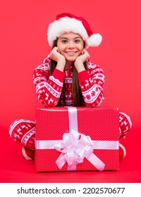 Merry Christmas. Happy Santa Teen Girl With Christmas Present Sit In Studio. Teen Girl