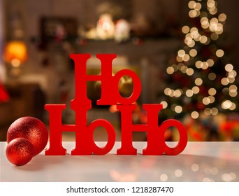 Merry Christmas ho ho ho greeting message with christmas blurry light background. 