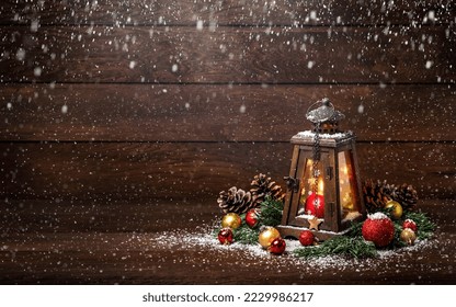 Merry Christmas! Lantern with candles and Christmas decorations on a wooden background - Powered by Shutterstock