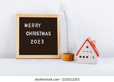 Merry Christmas Lettering On Letter Board. Eco Tree. Minimalistic New Year Background 2023