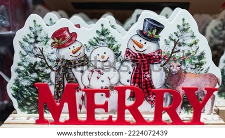 Merry Christmas - poster or postcard design with smiling Christmas snowmans. Christmas banner. Christmas holiday decorations. Nobody, selective focus