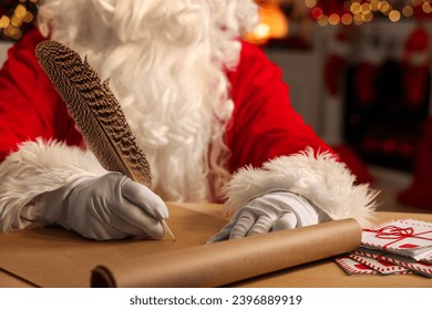 Merry Christmas. Santa Claus writing letter at table in room, closeup - Powered by Shutterstock