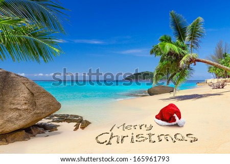 Merry Christmas with santa hat on the tropical beach 