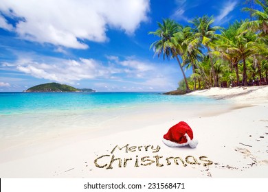 Merry Christmas with santa hat from the tropical beach - Powered by Shutterstock