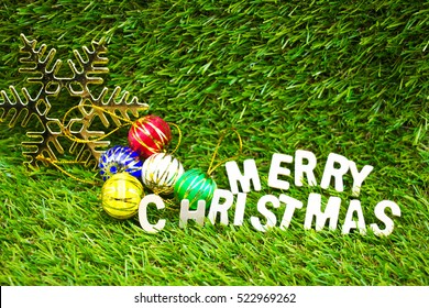 Merry Christmas Is A Selection Of Goodwill Greetings Are Often Used Around The World To Address Strangers, Family, Colleagues Or Friends During The Season,put The Letters On Green Grass.