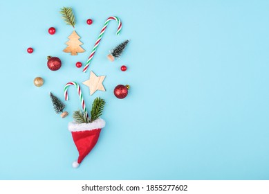 Merry Christmas.Christmas concept background.Santa claus hat with christmas ornament on blue background