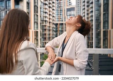 Merry Company Employee Spending Time With Female Colleague Outdoors