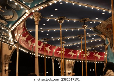 Merry go round carousel light in an amusement park in night
