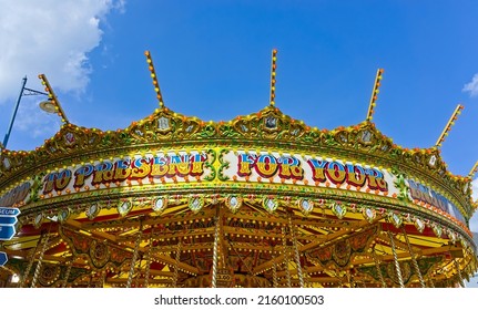A Merry Go Round Ride At An Annual May Fair In The UK. 