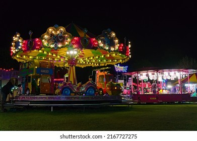 Merry Go Round Ride At The May Fair In The Park At Night. BOSTON Lincolnshire UK. May 2022