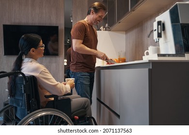 Merry male cooking with wife with paraleria - Powered by Shutterstock