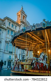 Merry-go-round Or Roundabout And Church In Rome