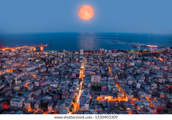 Mersin city center with lunar\
eclipse - Mersin, Turkey \