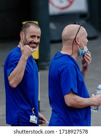 MERTHYR TYDFIL, WALES - 30 APRIL 2020 - NHS Staff Member Smiles As He Leaves Prince Charles Hospital To Participate In The Weekly Clap For Key Workers.