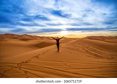 Merzouga Morocco 10.04.2018 - Happy Tourist With Striped Arms In The Sahara