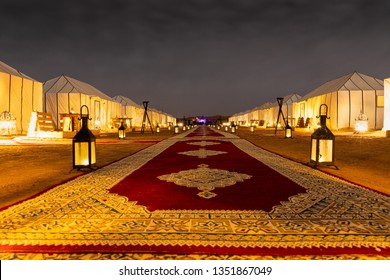 Merzouga / Morocco - February 19 2019: Main Path Accross The Tents And The Lanterns Of Golden Camp Site In Sahara Desert (Merzouga), Morocco During Night Time