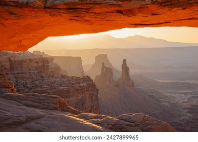 Mesa arch at dawn looking towards washerwoman arch, islands in the sky section of canyonlands national park, utah, united states of america, north america - Powered by Shutterstock