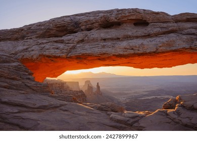 Mesa arch at dawn looking towards washerwoman arch, islands in the sky section of canyonlands national park, utah, united states of america, north america - Powered by Shutterstock