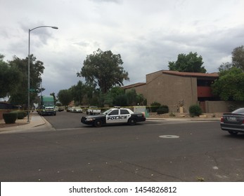 Mesa, Ariz. / US - March 18, 2015: Mesa Police Officers At A Crime Scene During  A Shooting Spree To Which Alleged White Supremacist Ryan Elliot Jiroux Later Pled Guilty. 2772