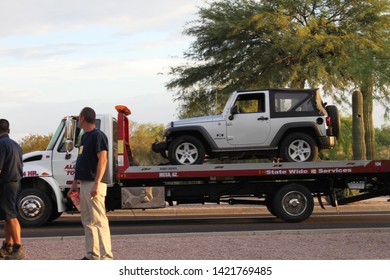 Mesa, Ariz. / US - September 6, 2010: Cars impounded during a joint Mesa and Gilbert police Labor Day sobriety checkpoint operation are loaded for towing. 8016
