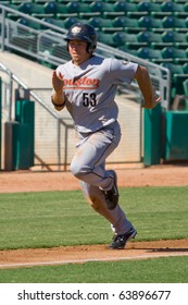 MESA, AZ - OCTOBER 18: J.B. Shuck, a top prospect for the Houston Astros, runs home for the Peoria Javelinas in an Arizona Fall League game Oct. 18, 2010 at HoHoKam Stadium in Mesa, Arizona. Peoria won, 4-2.