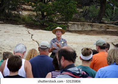 MESA VERDE, CO - JULY 26: A Park Ranger Gives Visitors A Pep Talk Before Leading Them Down To The Awe-inspiring Ruins Of Cliff Palace July 26, 2008 In Mesa Verde, CO.