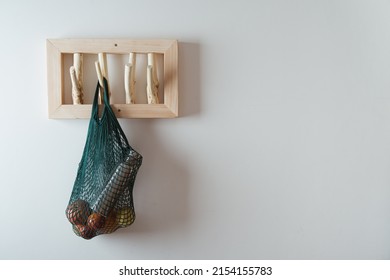 Mesh Bag And On Handmade Wooden Hang. Concept Of Slowlife Home