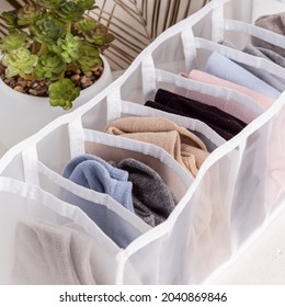 Mesh Closet Organizer Drawer Divider. Order In Closet. Neatly Folded Socks. Close Up. Square