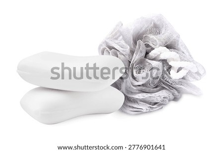 Mesh sponge and soap bars isolated on white