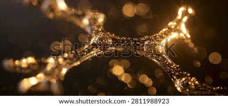 A mesmerizing abstract visualization of golden energy particles forming a dynamic, flowing structure against a dark background, illuminated by soft, out-of-focus bokeh lights.