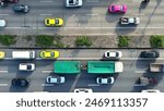 A mesmerizing aerial view of an intercity motorway transformed into a sea of cars during a traffic jam. The drone reveals the symphony of chaos. Traffic and vehicle concept. Road and cars background.
