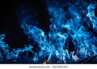 The mesmerizing Blue flames danced gracefully against the pitch-black backdrop