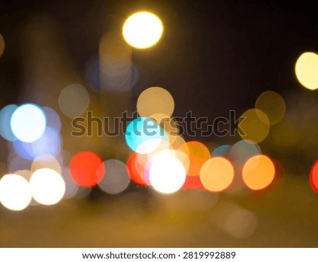 A mesmerizing display of abstract bokeh lights, creating a dreamy and ethereal atmosphere with vibrant colors against a dark backdrop.