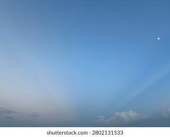 Mesmerizing evening with rays and moon.