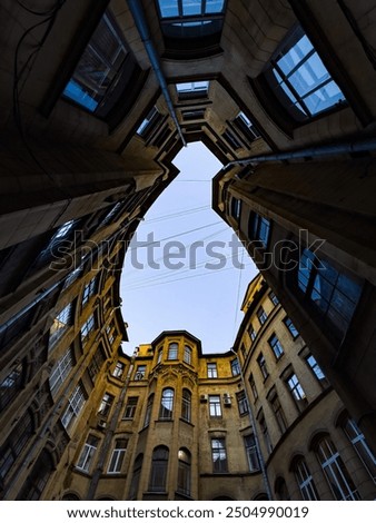 Similar – Schmales Fenster in der Steinmauer mit Blick auf das Pariser Stadtbild