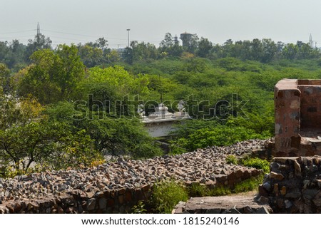 A mesmerizing view of architecture of main tomb at old fort from side lawn.