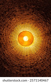 A mesmerizing view of a dome interior showcasing a detailed pattern of brickwork illuminated by a central glowing light.