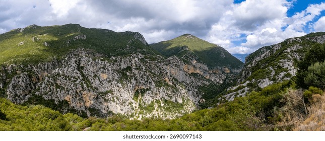 A mesmerizing view of mountains under the cloudy sky