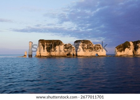 A mesmerizing view of Old Harry Rocks, Dorset against the blue sky