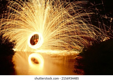 A mesmerizing view of pyrotechnic fire with the reflection on the ground