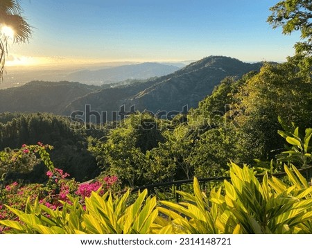 Mesmerizing view from veranda during sunset on mountain range, and Tropical National Forest of El Yunque in Puerto Rico