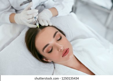 Mesotherapy For Hair Growth. Woman Receiving Injection In Head