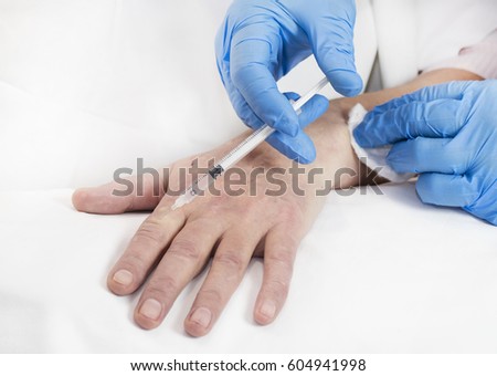 Mesotherapy process on a female hand in clinic 