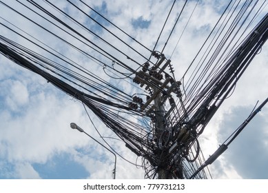 Mess and busy wire on pole with blue sky back ground - Shutterstock ID 779731213