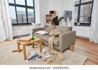 Mess, Disorder And Interior Concept - View Of Messy Home Living Room With Scattered Stuff