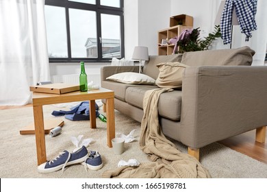 Mess, Disorder And Interior Concept - View Of Messy Home Living Room With Scattered Stuff