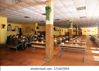 At A Mess Hall: Soldiers Sitting At Set-out Tables And Eating. Novo-Petrivtsi Military Base, Ukraine. November 12, 2018