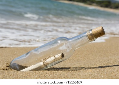 Message in a bottle, close up - Shutterstock ID 715155109