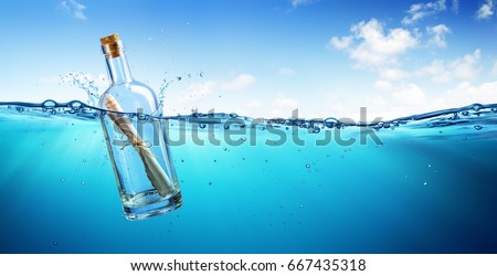 Message In Bottle floating In The Ocean
